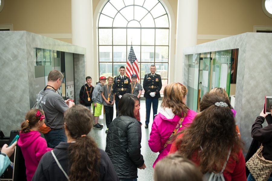 Members of The Old Guard pose for photographs in the Welcome Center of Arlington National Cemetery