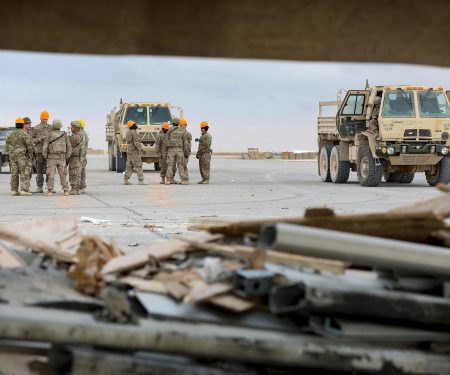 Soldiers, Airmen and contractors clearing debris after Al-Asad Airbase missile attack