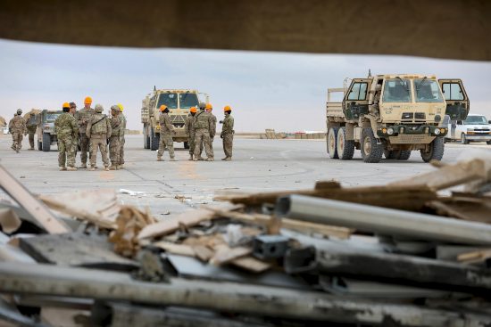 Soldiers, Airmen and contractors clearing debris after Al-Asad Airbase missile attack