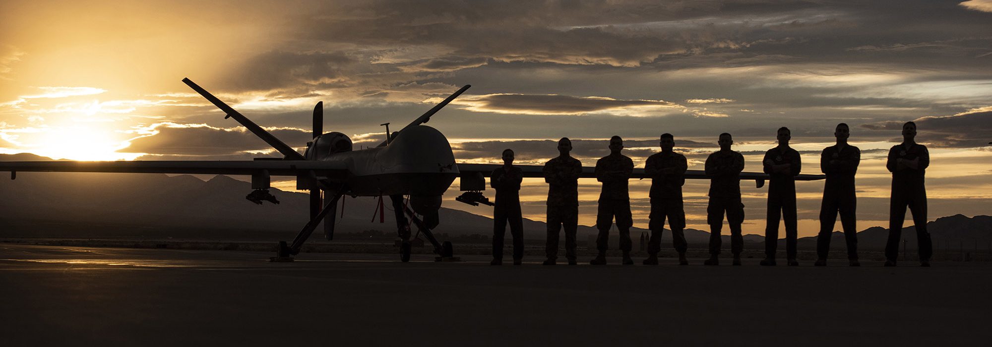 MQ-9 Reaper and aircrew underneath Nevada sunset