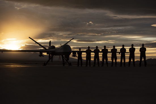 MQ-9 Reaper and aircrew underneath Nevada sunset