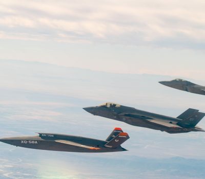 A U.S. Air Force F-22 Raptor and F-35A Lightning II fly in formation with the XQ-58A Valkyrie low-cost unmanned aerial vehicle over the U.S. Army Yuma Proving Ground testing range, Ariz., during a series of tests Dec. 9, 2020. This integrated test follows a series of gatewayONE ground tests that began during the inaugural Department of the Air Force on-ramp last year in December. Courtesy photo.