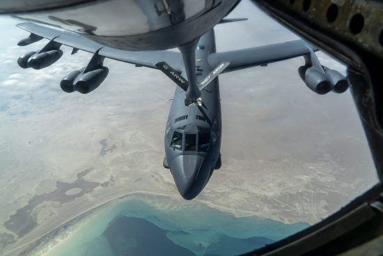 B-52 Stratofortress and F-16 Fighting Falcon fly over U.S. Central Command