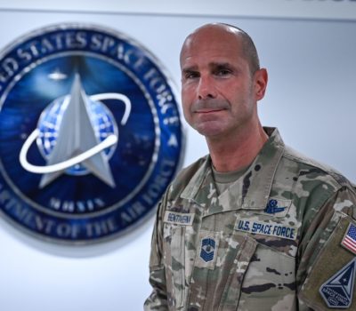 Chief Master Sgt. John F. Bentivegna stands in front of the U.S. Space Force Hallway after receiving news on his selection as the next Chief Master Sergeant of the Space Force, Pentagon, Arlington, Va., May 5, 2023.