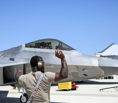 A maintainer from the 71st Fighter Generation Squadron taxis pre-flight a student conducting their first F-22 flights during training at Joint Base Langley-Eustis, Virginia, June 5, 2023. U.S. Air Force photo by Tech. Sgt. Ceaira Tinsley
