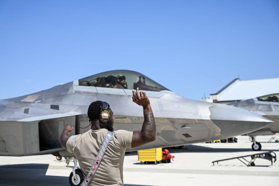 A maintainer from the 71st Fighter Generation Squadron taxis pre-flight a student conducting their first F-22 flights during training at Joint Base Langley-Eustis, Virginia, June 5, 2023. U.S. Air Force photo by Tech. Sgt. Ceaira Tinsley