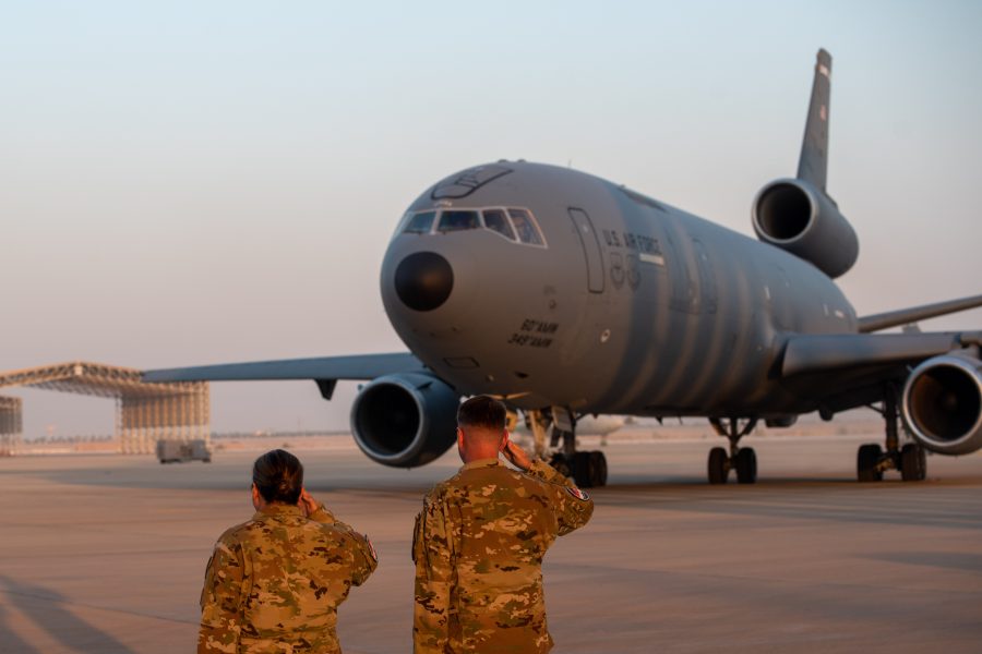 U.S. Airmen salute a KC-10 as it begins to depart after conducting the airframe's final combat deployment at Prince Sultan Air Base (PSAB), Kingdom of Saudi Arabia, Oct. 5, 2023.