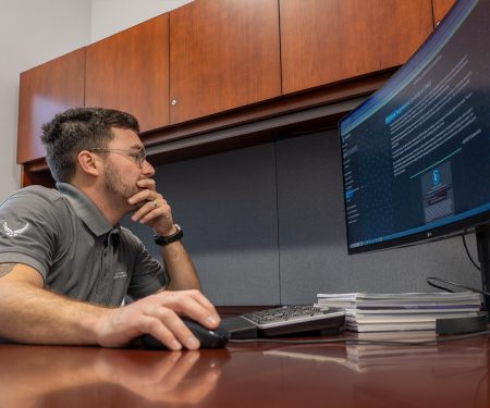 Air Force Research Laboratory Public Affairs Specialist Kenneth McNulty conducts background research for a project using NIPRGPT, a large language model generative artificial intelligence tool developed by AFRL in conjunction with other DAF partners. Photo by Keith C Lewis, courtesy AFRL 
