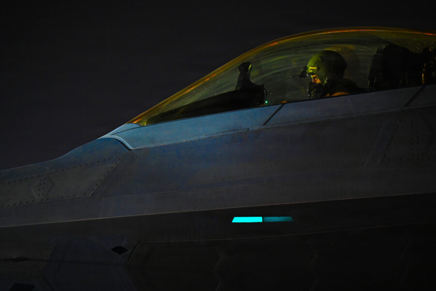 US Air Force pilot in F-22 Raptor cockpit prepares to take off for mission in Iran.