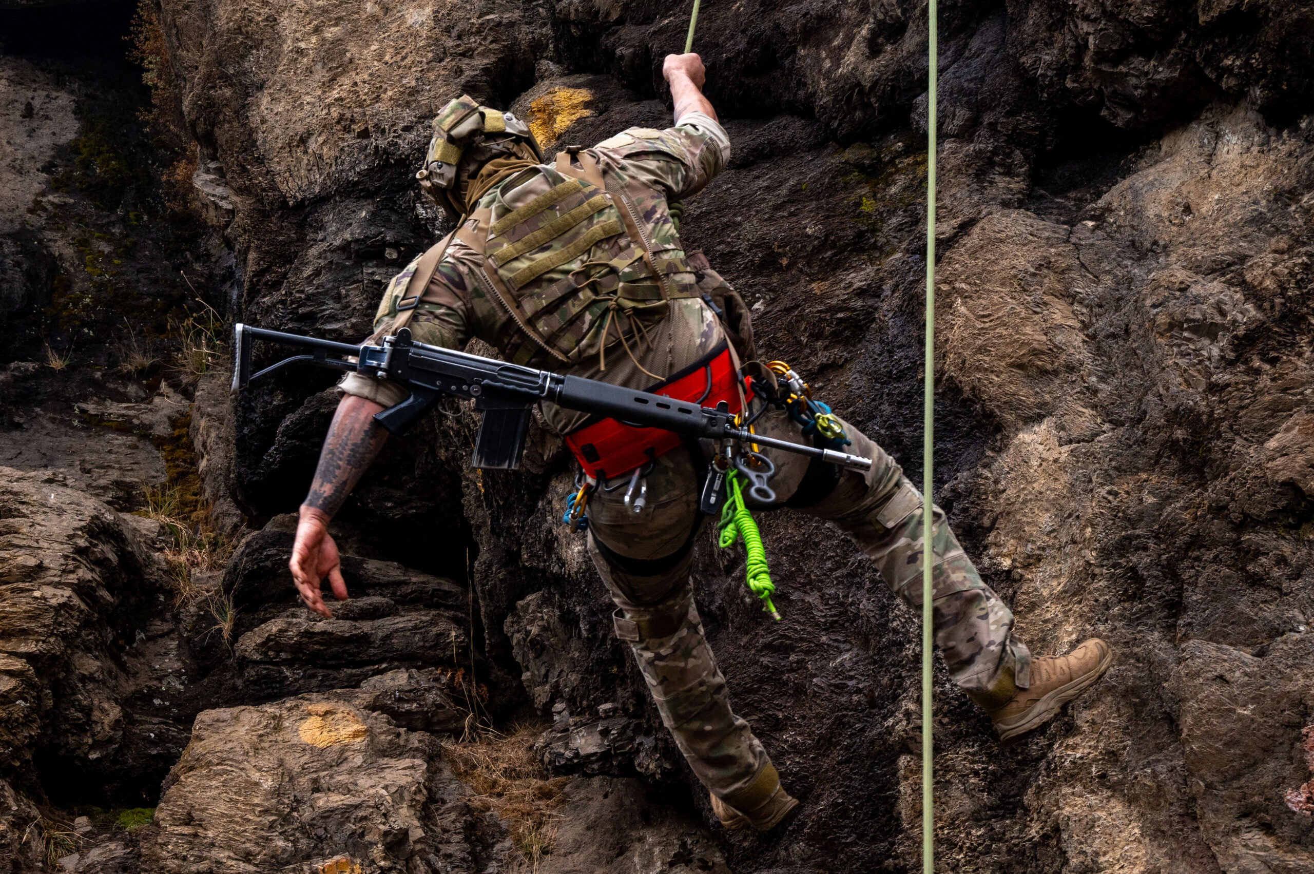 A U.S. Airman from the 492nd Special Operations Wing rappels down a cliff face during training in Bariloche, Argentina